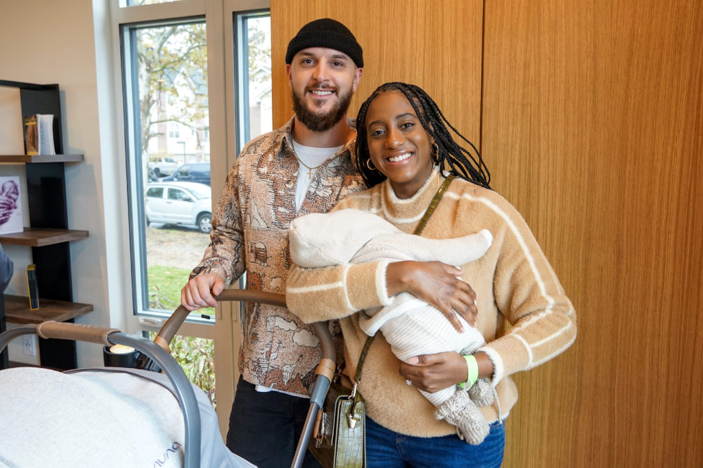 A young family with baby at Detroit Birth Center opening. 