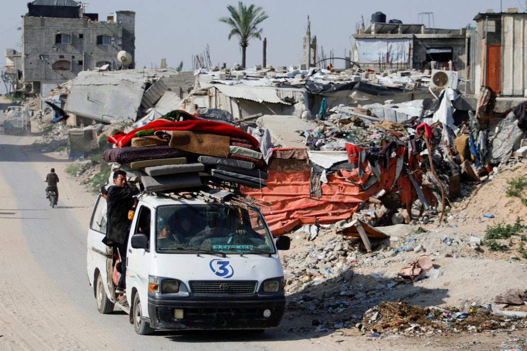 Palestinians make their way to flee their homes, after the Israel army issued evacuation orders for a number of neighborho...