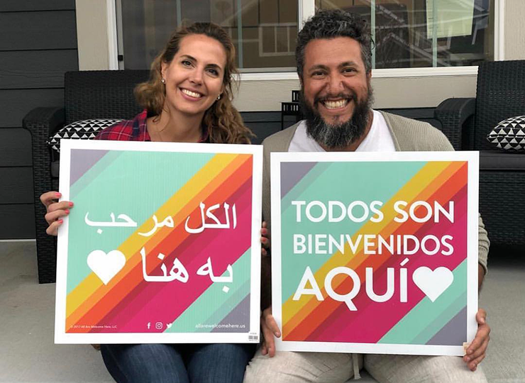 AAWH lawn signs in Arabic and Spanish.