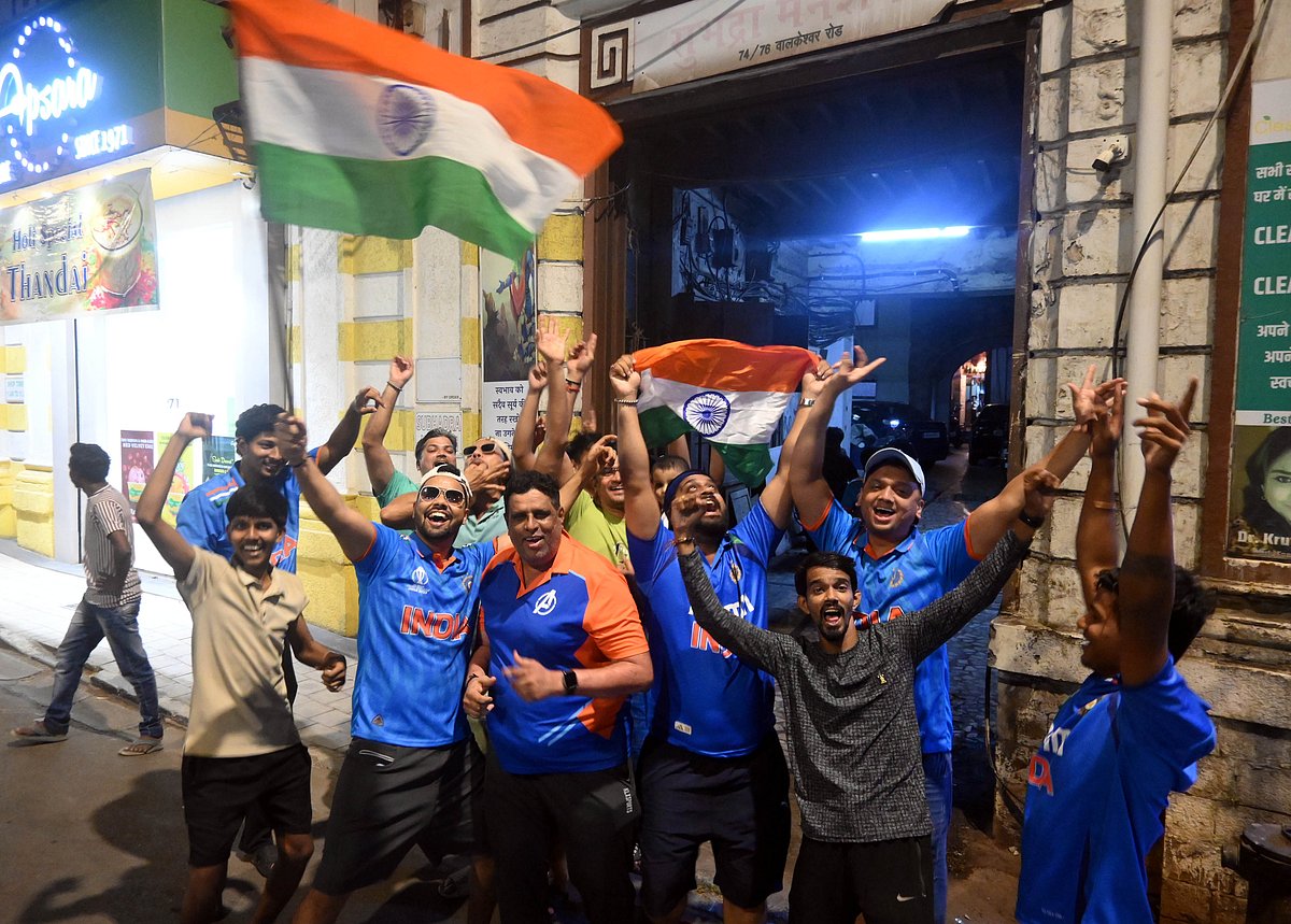 Cricket supporters dance their heart out at  India's win.