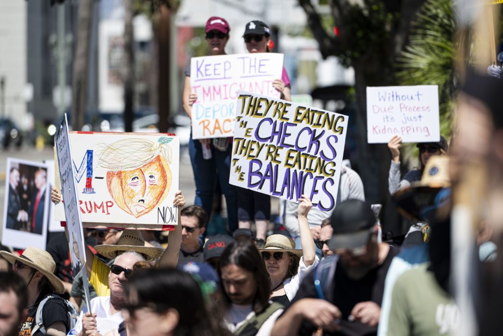 Protesters rally and march for immigrant rights in LA