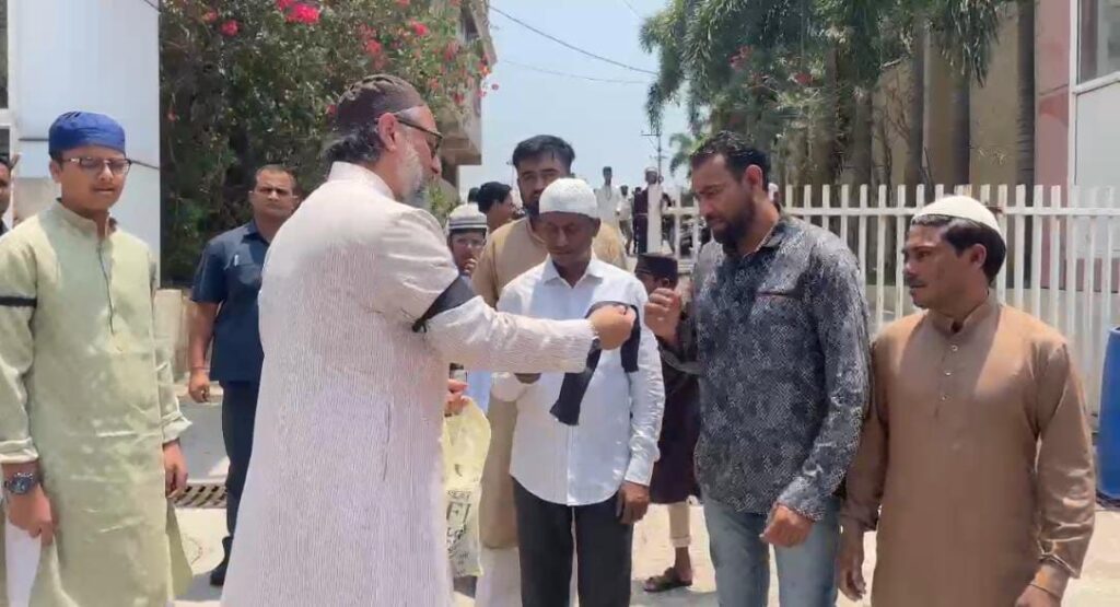 Owaisi distributed black armbands outside a mosque in Hyderabad
