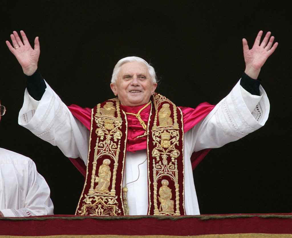 FILE PHOTO: Pope Benedict XVI, Cardinal Joseph Ratzinger of Germany, waves from a balcony of St. Peter's Basilic..