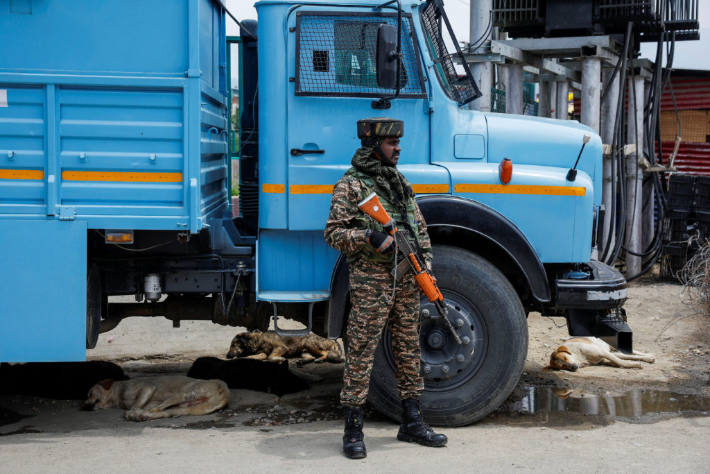 An Indian security force personnel stands guard on a street, following the Pahalgam attack in south Kashmir, in Srinagar