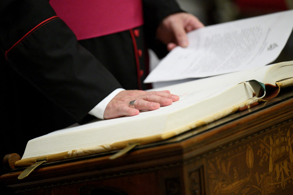 Officials, members of the clergy and Conclave staff take Oath of Secrecy in Pauline Chapel, at the Vatican