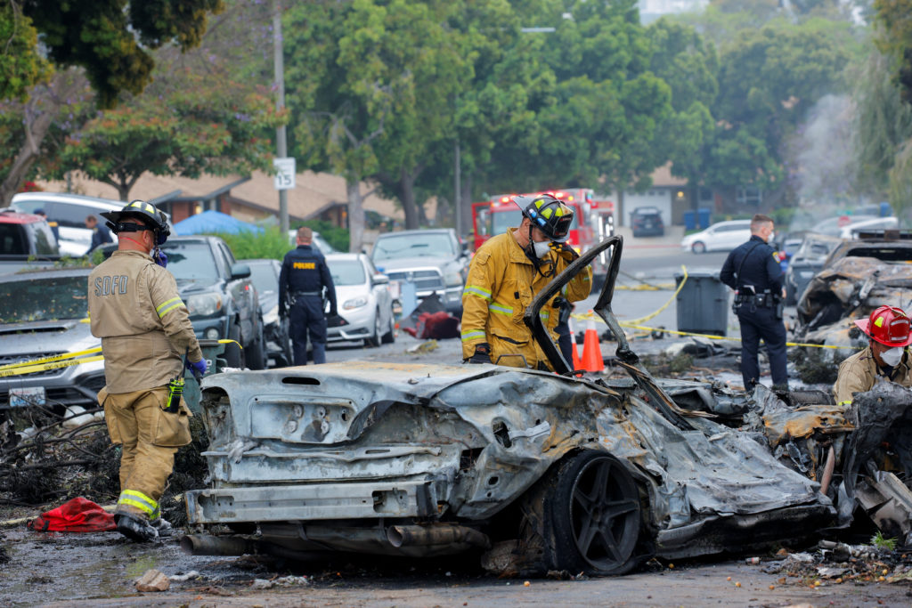 Crash scene after a civilian aircraft went down in a neighborhood, in San Diego