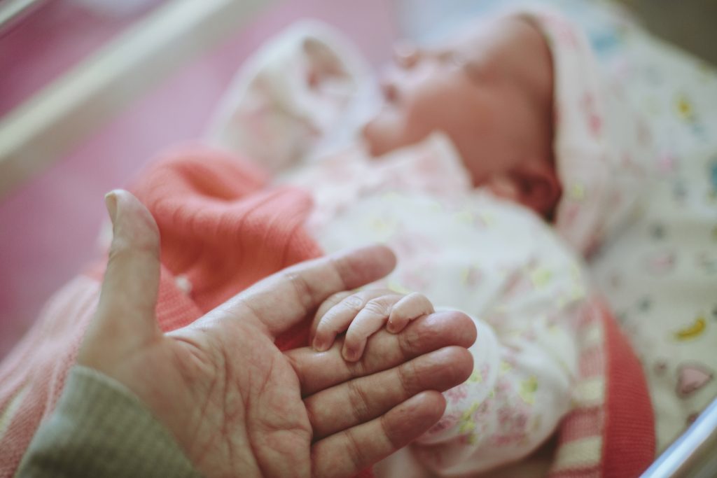 For newborn babies, human touch may be a brain booster. Photo by Sally Anscombe/via Getty Images