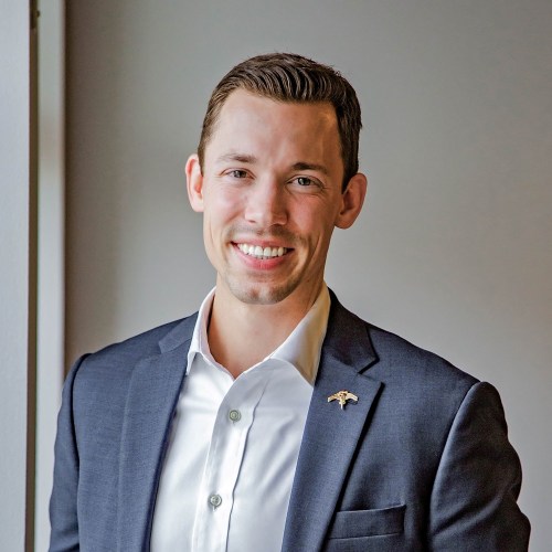 A portrait of a smiling man