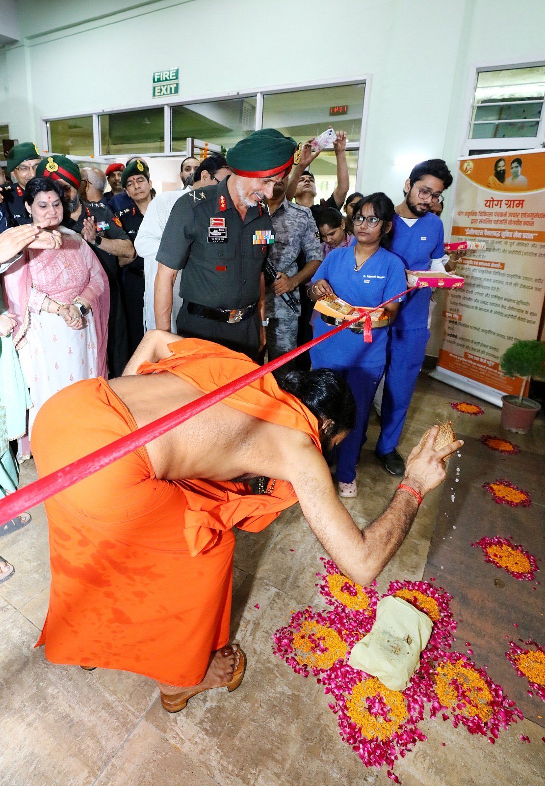 Swami Ramdev breaking coconut