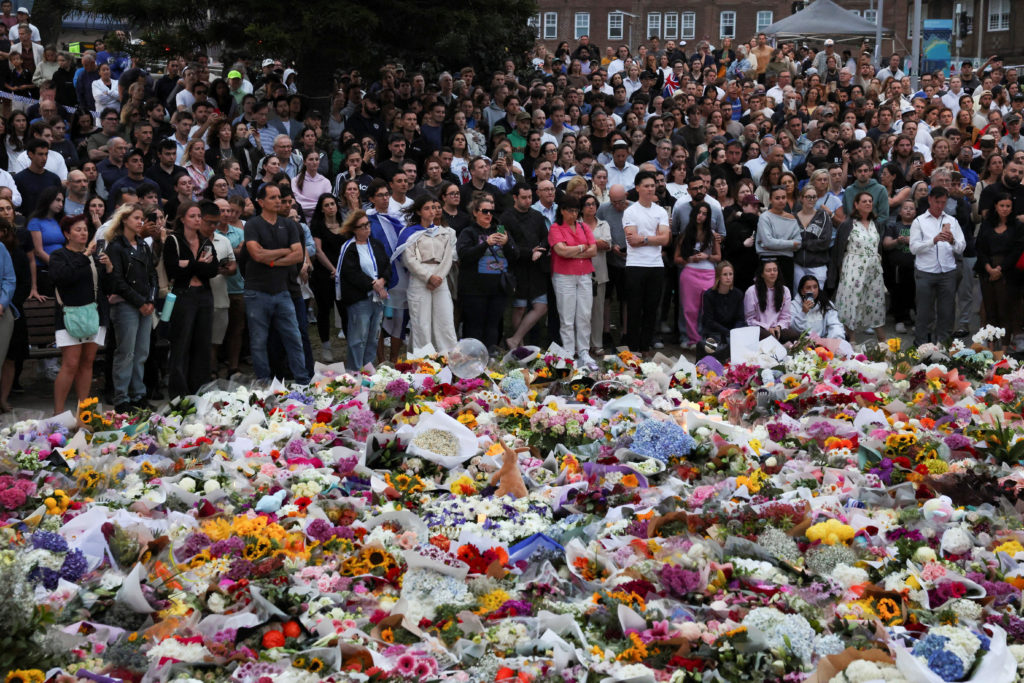 People pay respects at Bondi Pavilion to victims of a shooting during a Jewish holiday celebration at Bondi Beach, in Sydney