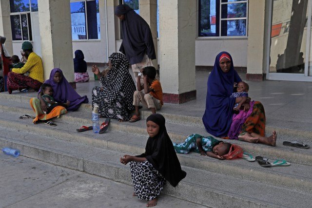Patients sit at the entrance of Banadir Hospital in Mogadishu, Somalia, on Tuesday, Nov. 11, 2025.