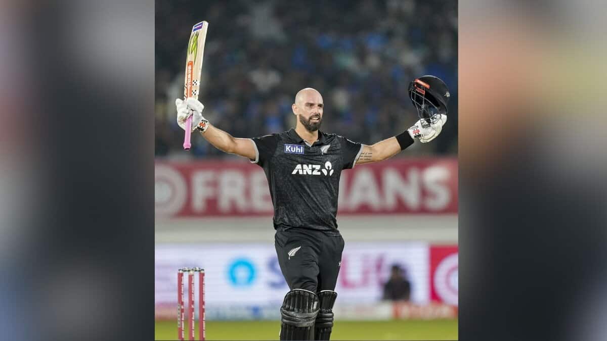 New Zealand's Daryl Mitchell celebrates his century during the second ODI cricket match between India and New Zealand at Niranjan Shah Stadium in Rajkot on Wednesday. (PTI Photo/Ravi Choudhary)