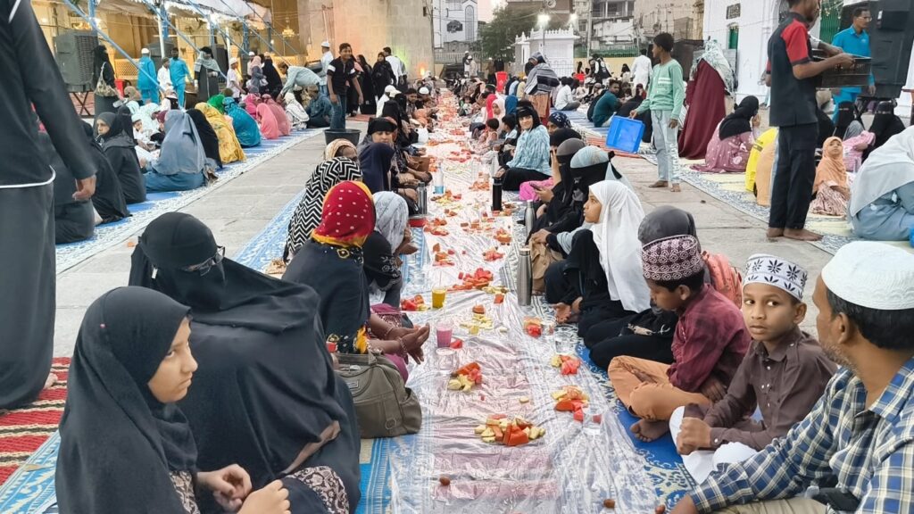 Iftaari gathering at Makkah Masjid with community members breaking fast together.