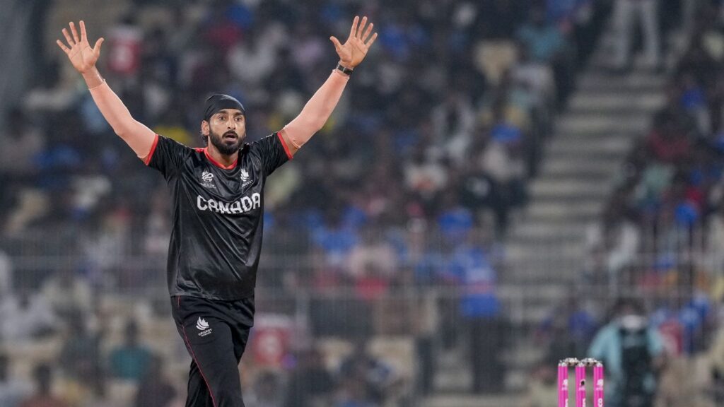 Afghan cricket player celebrating after winning match against Canada at the cricket stadium.