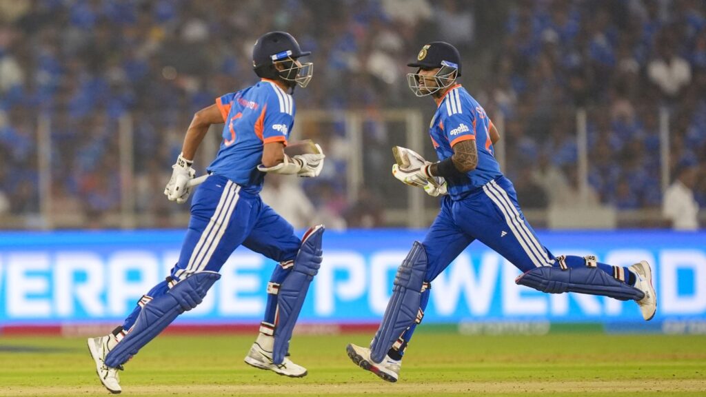 South African cricket players running on the field after winning a T20 World Cup match at Ahmedabad.