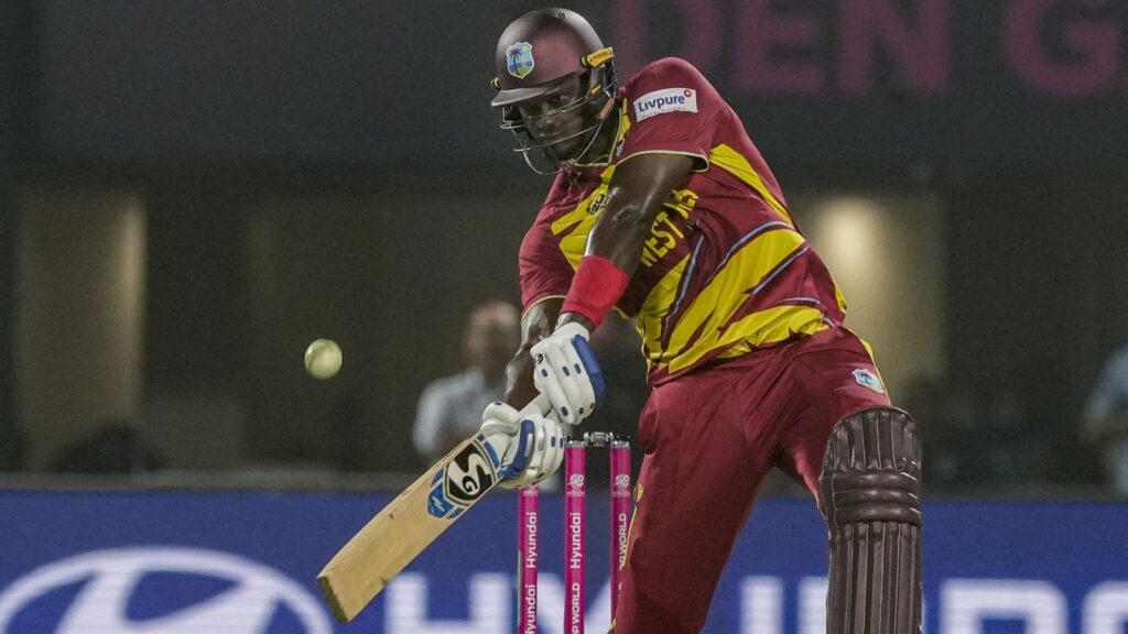 West Indies batsman hitting the ball in a T20 World Cup 2026 match against India, focusing on intense gam.