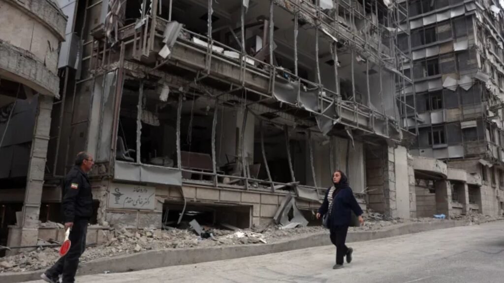 Damage to a multi-storey building caused by recent airstrikes, with debris and destruction visible on the.