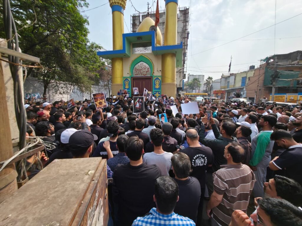 Protesters gather outside a mosque amid tensions following US-Israel actions and regional conflicts. Larg.